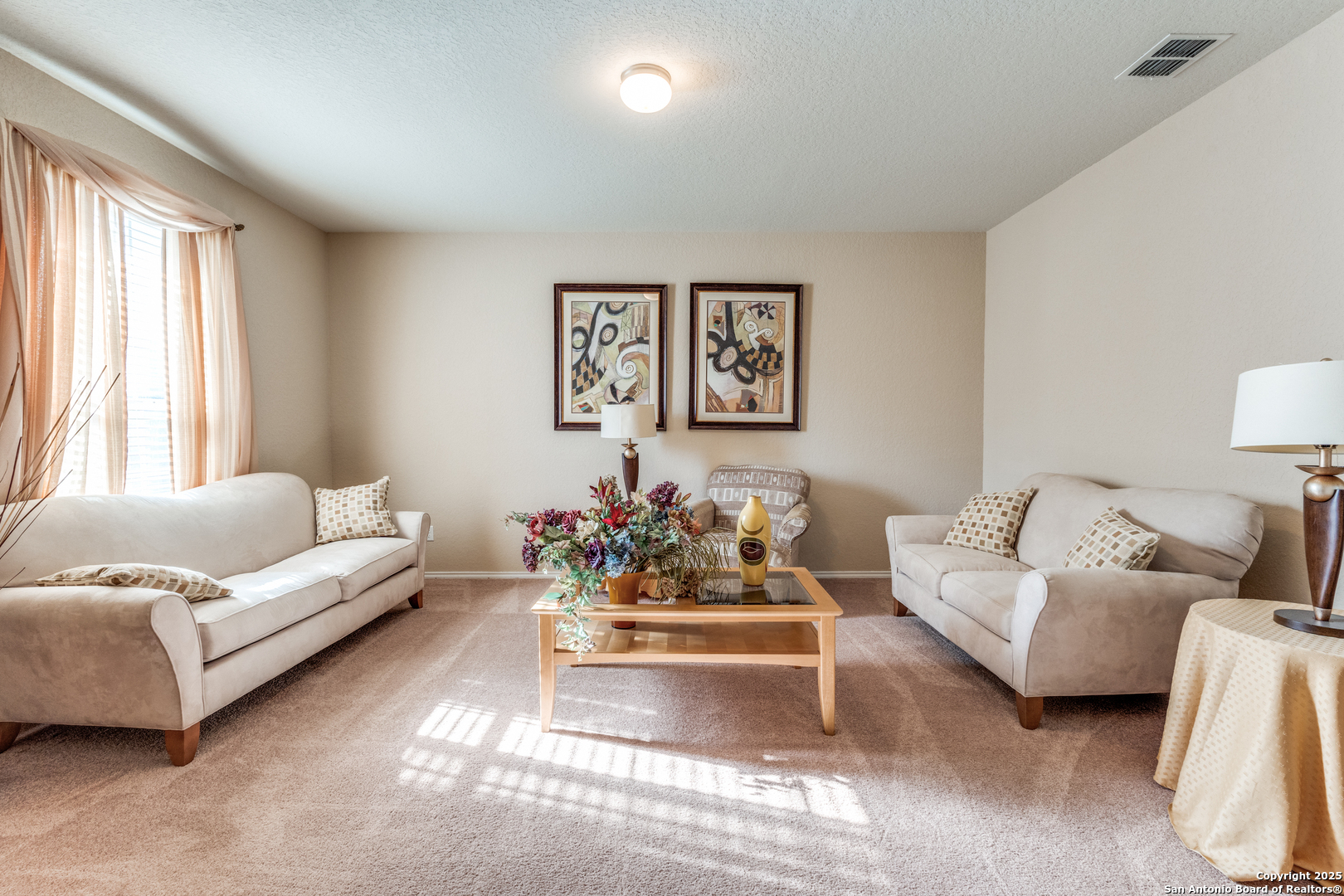 15923 Silver Rose Selma, TX 78154 - Photo 2 of 19 a living room with furniture and a large window