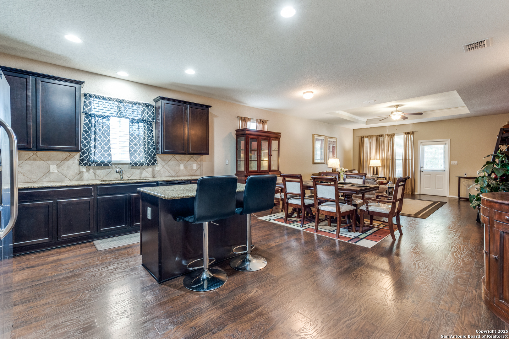 15923 Silver Rose Selma, TX 78154 - Photo 7 of 19 a view of kitchen with dining table chairs and wooden floor
