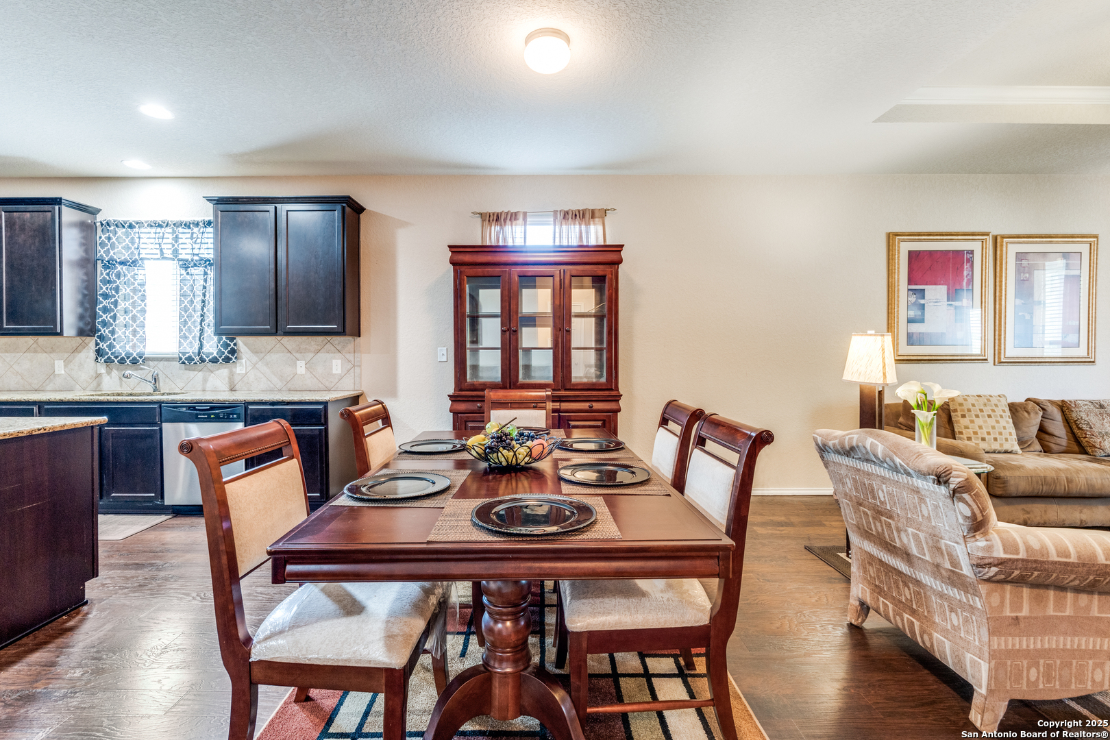 15923 Silver Rose Selma, TX 78154 - Photo 9 of 19 a view of a dining room with furniture window and wooden floor