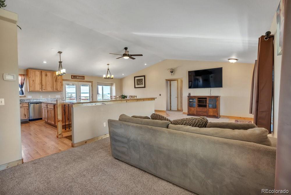 24535 County Road 5 Elbert, CO 80106 - Photo 15 of 45 a living room with furniture and a flat screen tv