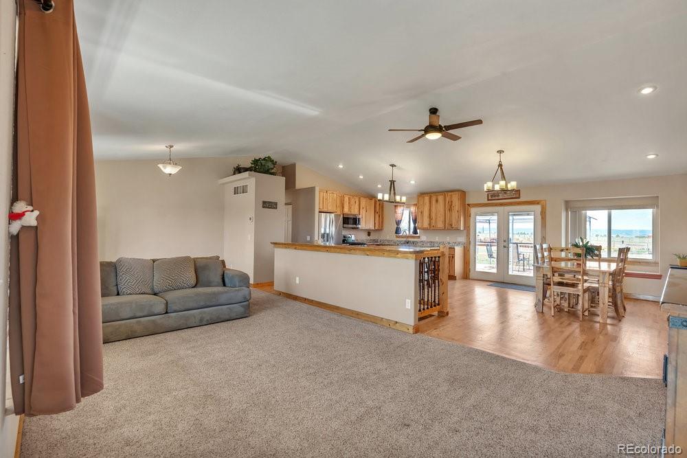 24535 County Road 5 Elbert, CO 80106 - Photo 16 of 45 a living room with furniture and kitchen view