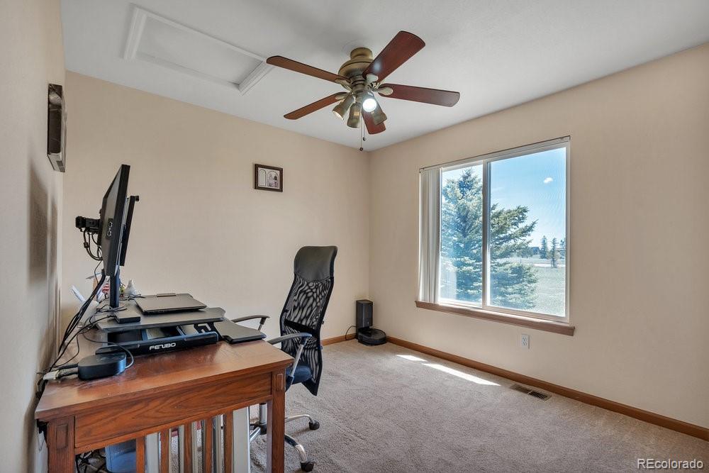 24535 County Road 5 Elbert, CO 80106 - Photo 19 of 45 a view of a workspace with furniture and a window