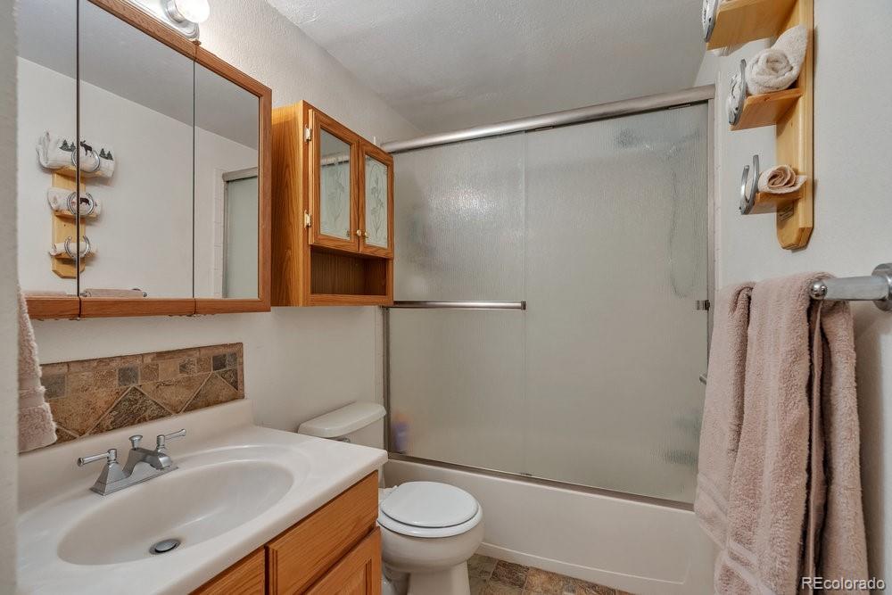 24535 County Road 5 Elbert, CO 80106 - Photo 20 of 45 a bathroom with a sink toilet and shower