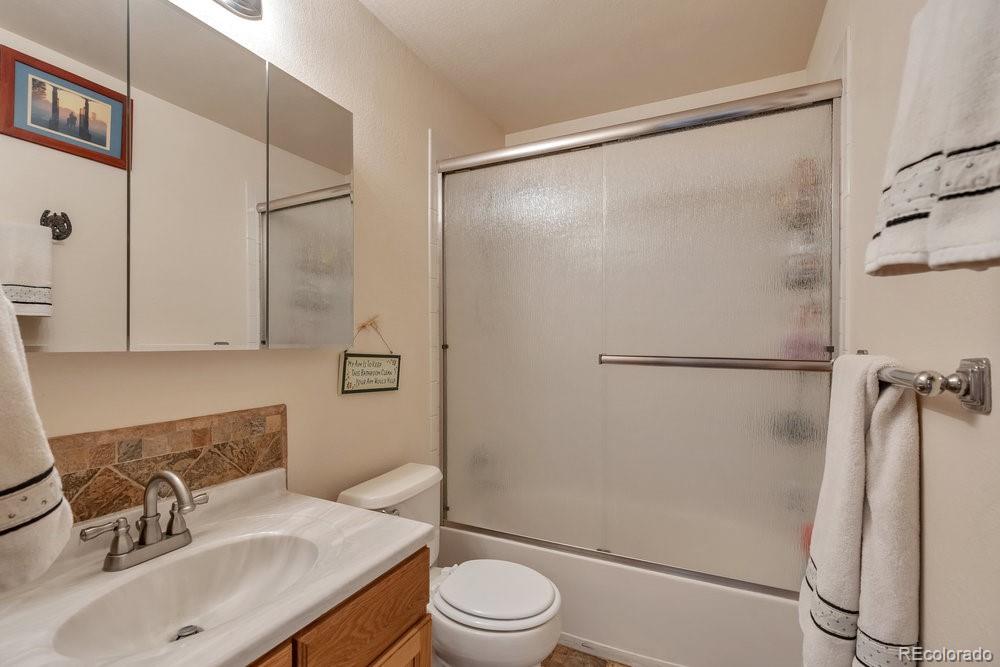 24535 County Road 5 Elbert, CO 80106 - Photo 24 of 45 a bathroom with a sink toilet and shower