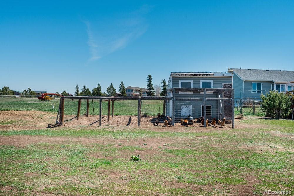 24535 County Road 5 Elbert, CO 80106 - Photo 36 of 45 a backyard of a house with table and chairs