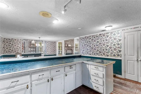 a view of a livingroom with wooden floor