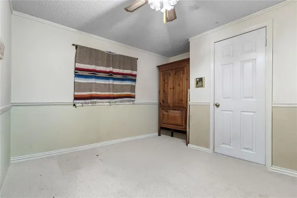 a bed room with a bed and a chandelier