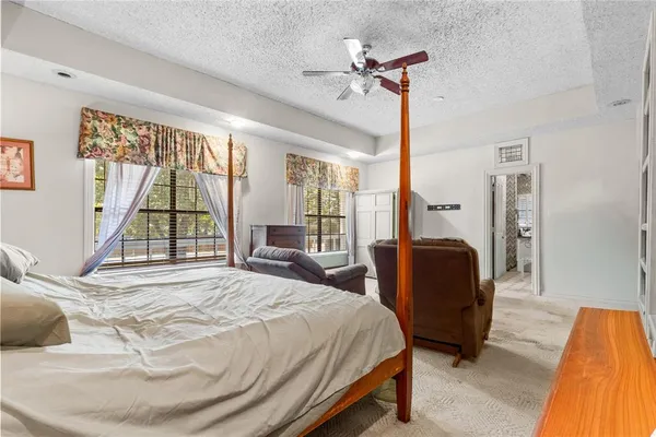 a living room with furniture a rug and a window
