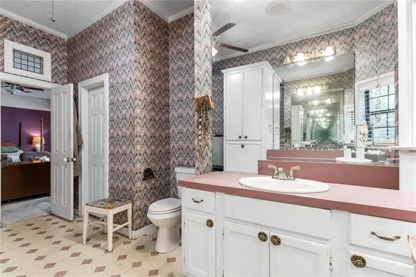 a bedroom with a bed and a chair