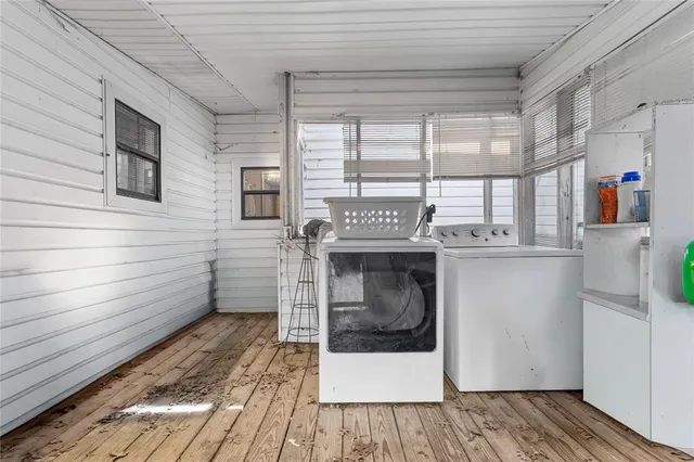 a bathroom with a bathtub sink mirror vanity and toilet