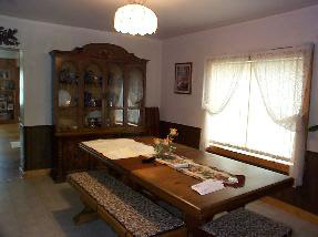 8951 Stillman Valley Road Stillman Valley, IL 61084 - Photo 4 of 5 a view of a dining room with furniture and chandelier