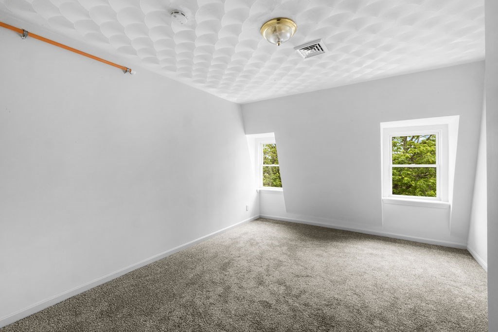 186 John Street Fall River, MA 02721 - Photo 14 of 38 an empty room with windows