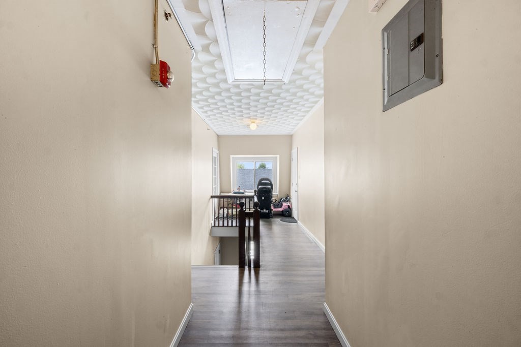 186 John Street Fall River, MA 02721 - Photo 21 of 38 a view of a hallway with wooden floor and a dining room