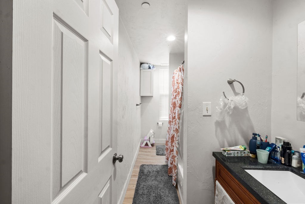 186 John Street Fall River, MA 02721 - Photo 24 of 38 a bathroom with a sink a mirror and shower