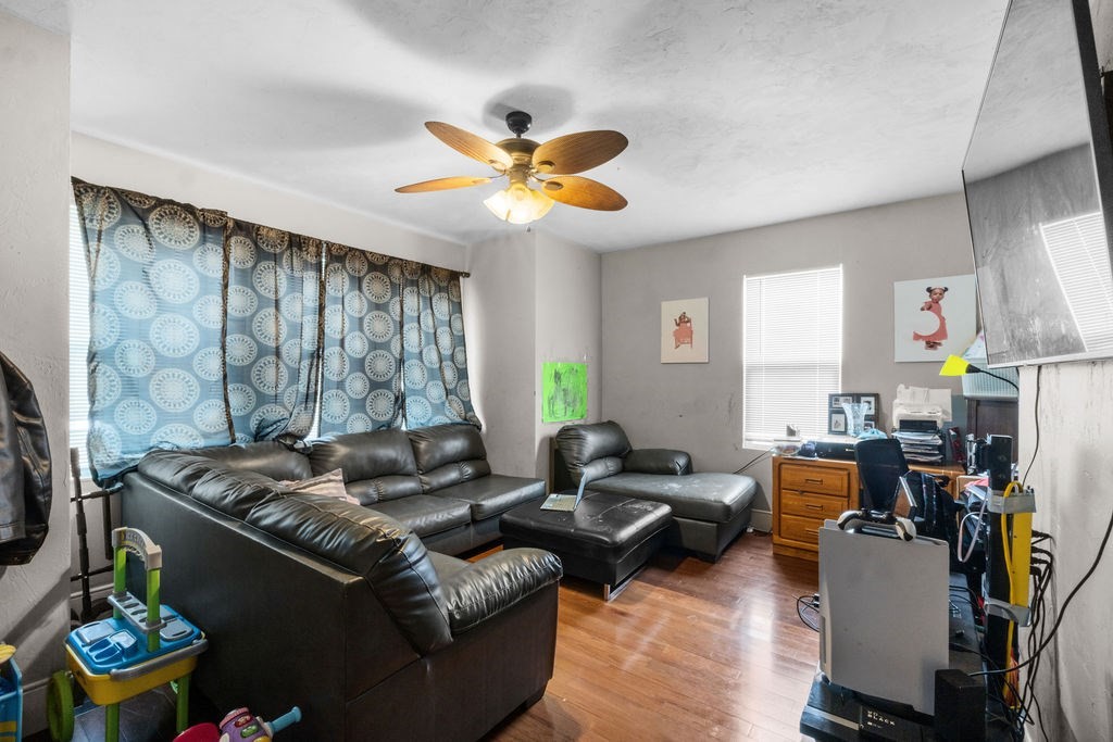 186 John Street Fall River, MA 02721 - Photo 25 of 38 a living room with furniture and a chandelier
