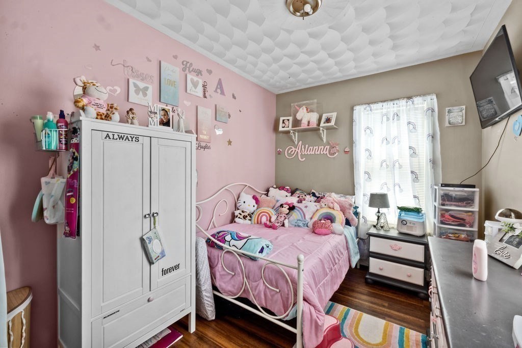 186 John Street Fall River, MA 02721 - Photo 32 of 38 a bedroom with a bed and a window