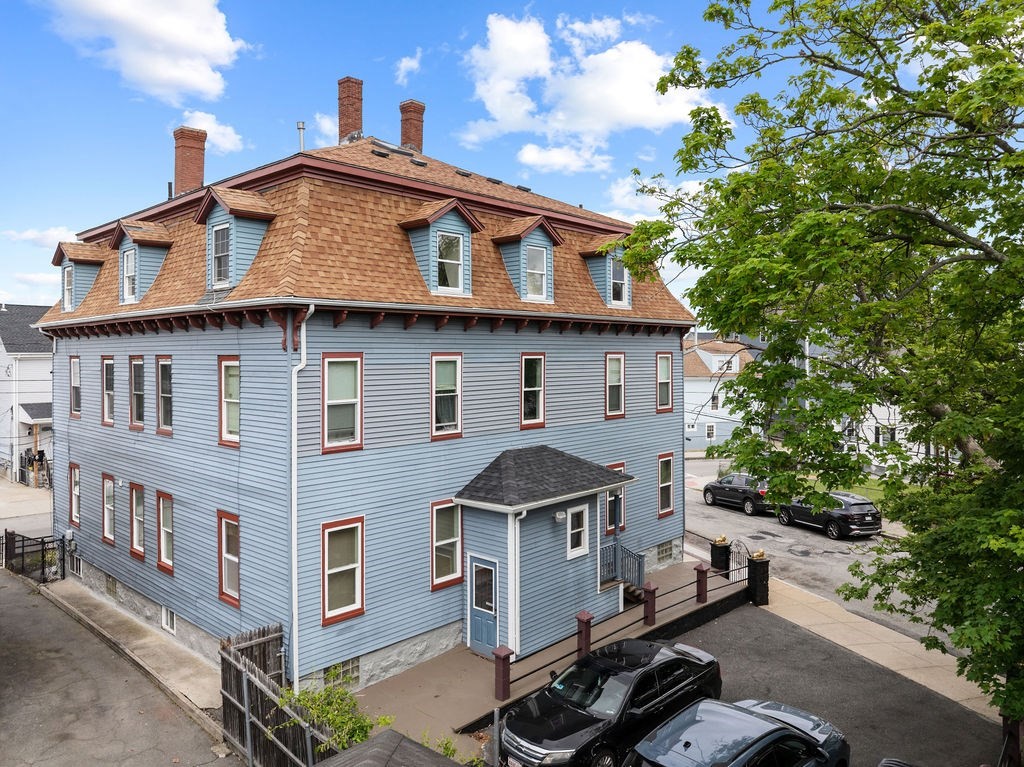 186 John Street Fall River, MA 02721 - Photo 5 of 38 a front view of a house with a porch