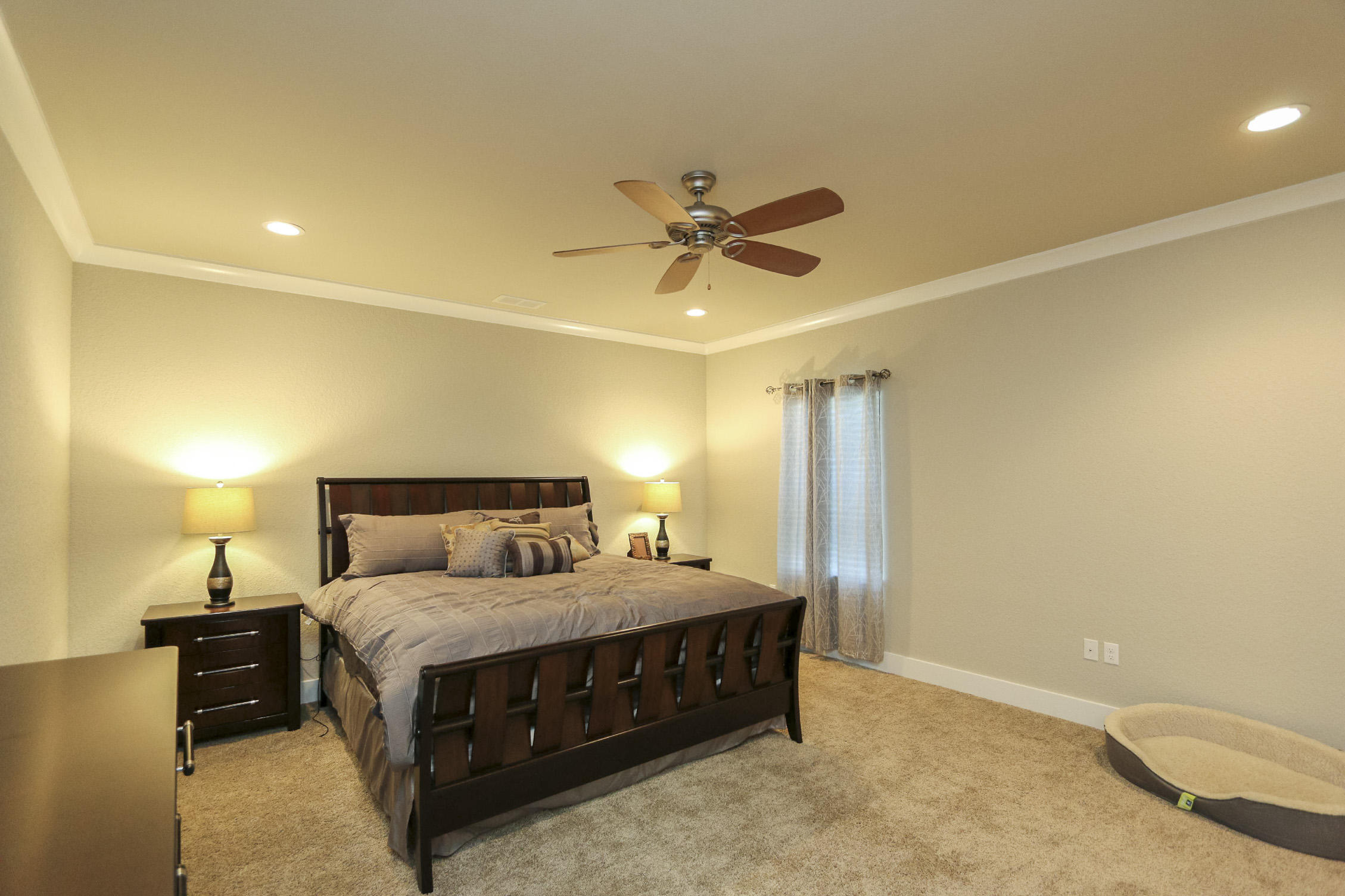 995 Airport Road, Unit 19 Destin, FL 32541 - Photo 21 of 39 a bedroom with a bed and a chandelier