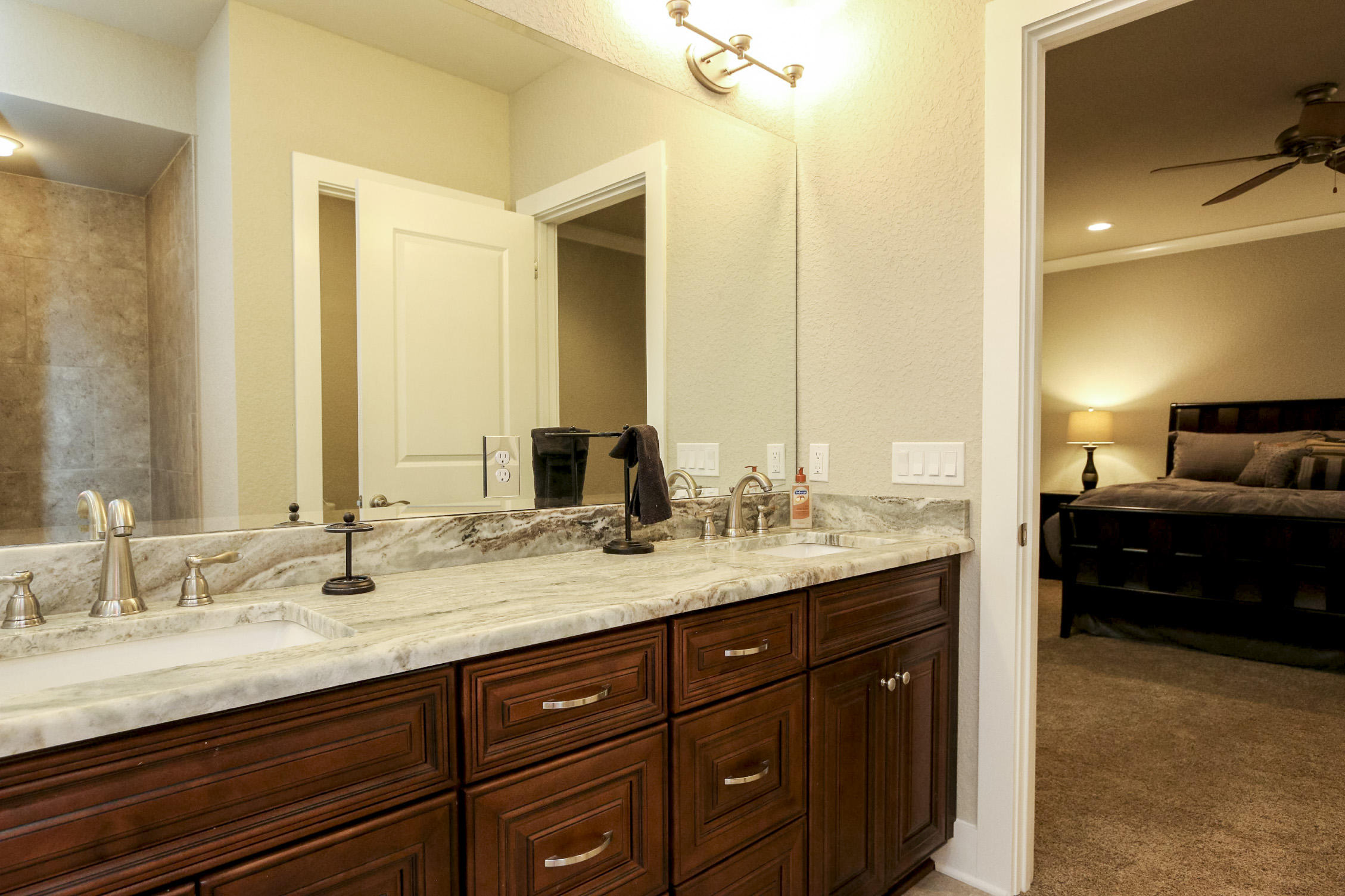 995 Airport Road, Unit 19 Destin, FL 32541 - Photo 24 of 39 a bathroom with a sink double vanity and a mirror