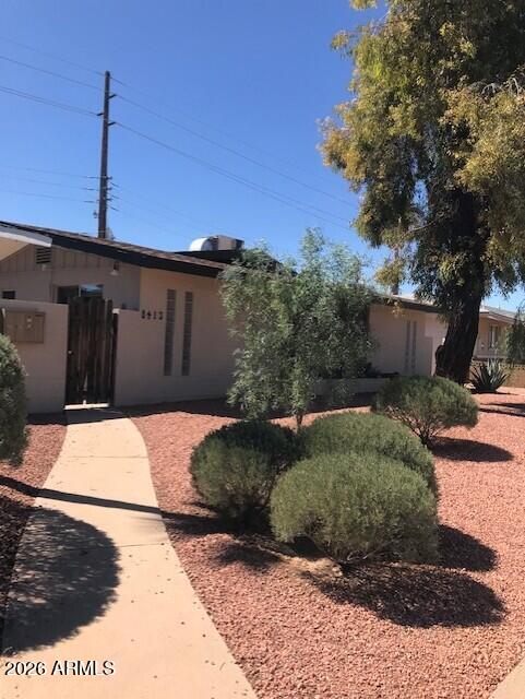 8413 East Coronado Road, Unit 3 Scottsdale, AZ 85257 - Photo 5 of 5 a view of a pathway along the house