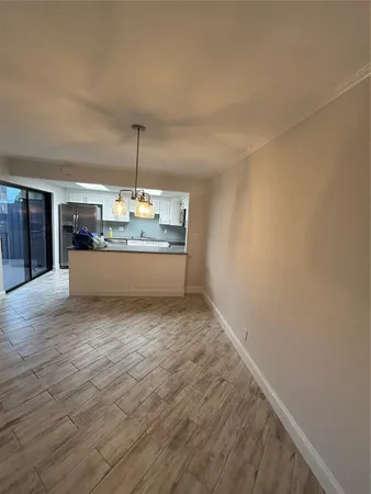 a view of a kitchen with a sink and a window