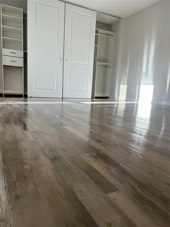 a view of a livingroom with wooden floor