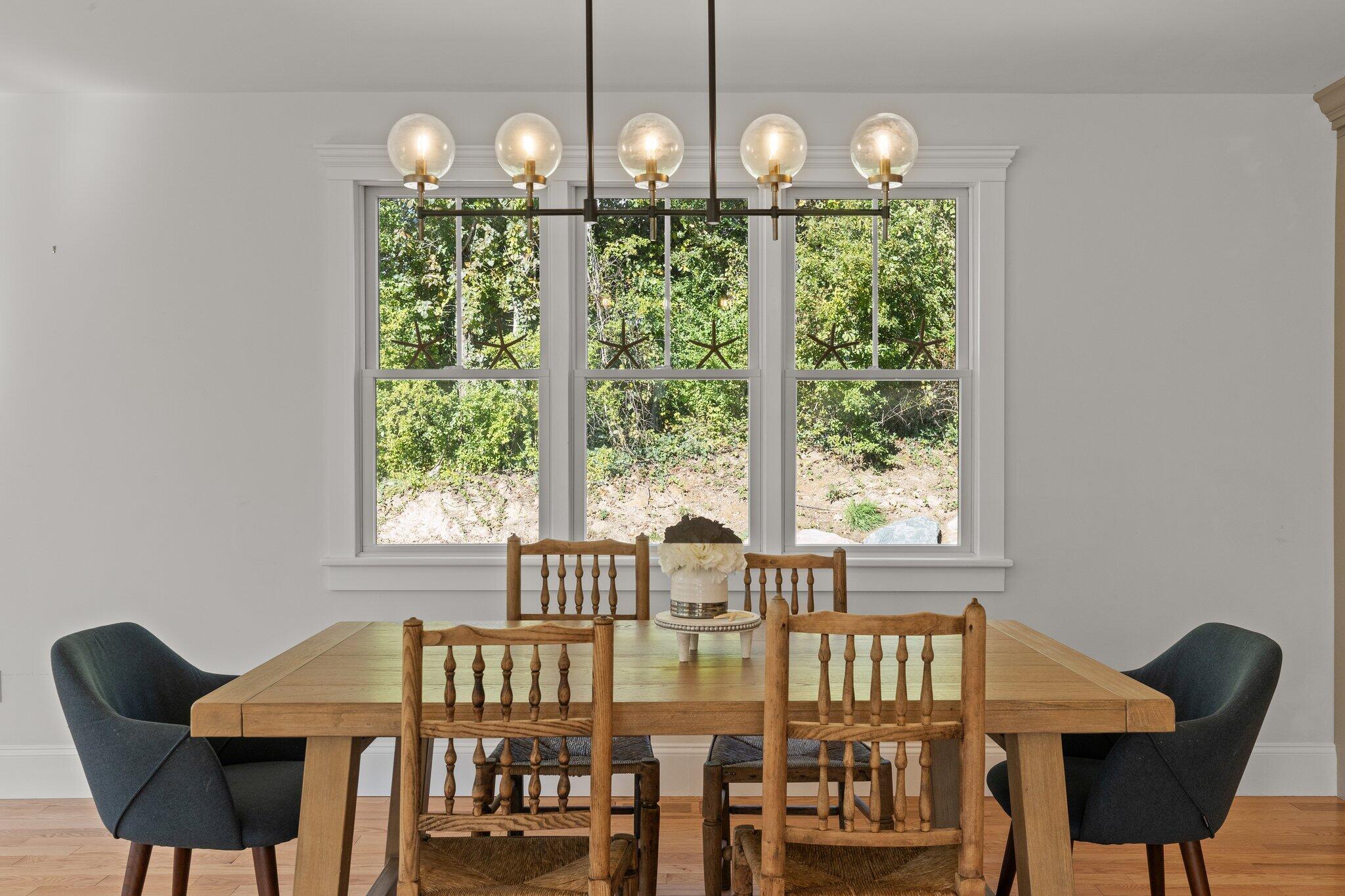 12 Jonathan Lane Sandwich, MA 02563 - Photo 12 of 57 a view of a dining room with furniture window and outside view