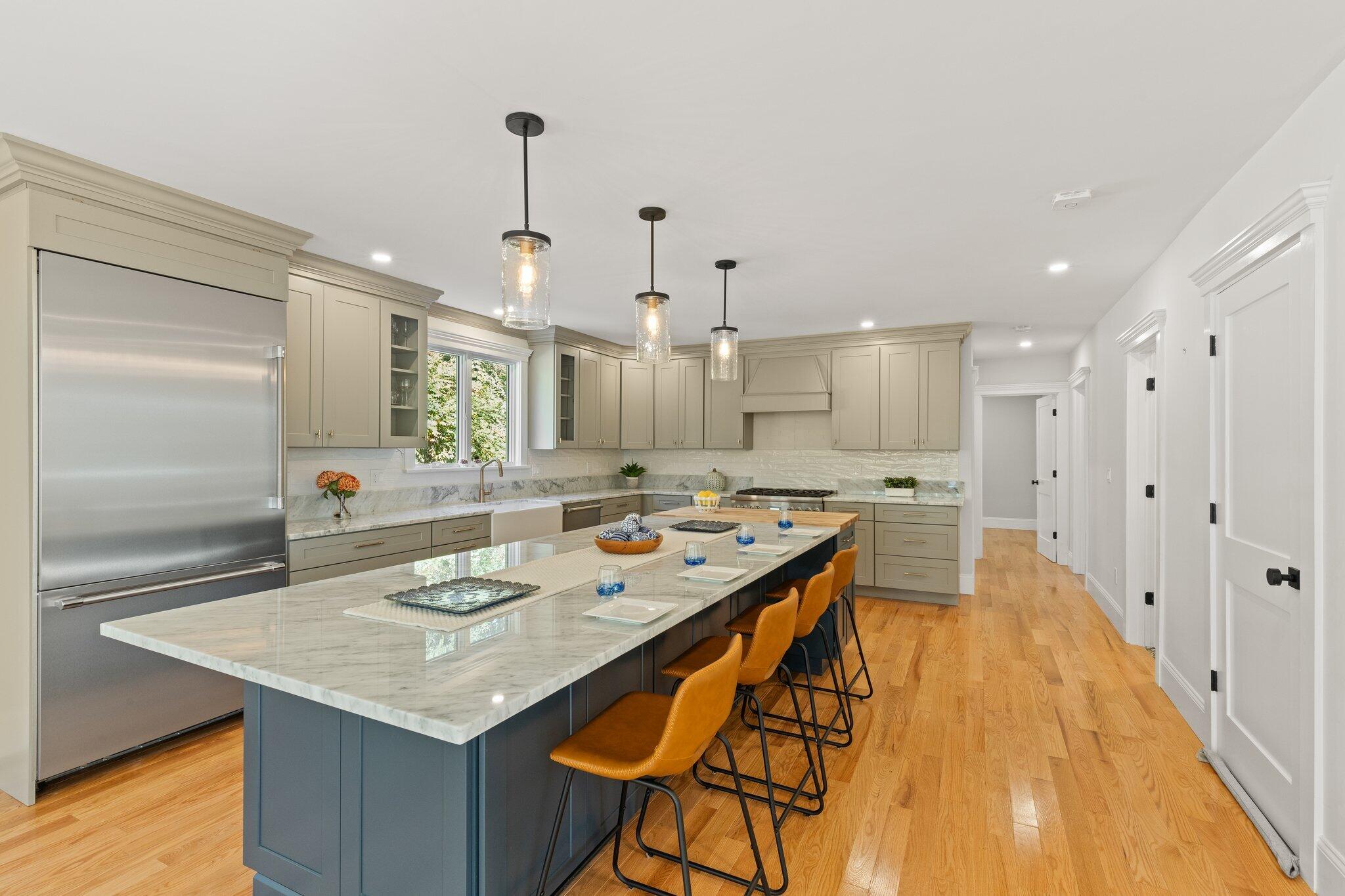 12 Jonathan Lane Sandwich, MA 02563 - Photo 17 of 57 a large kitchen with a table and chairs