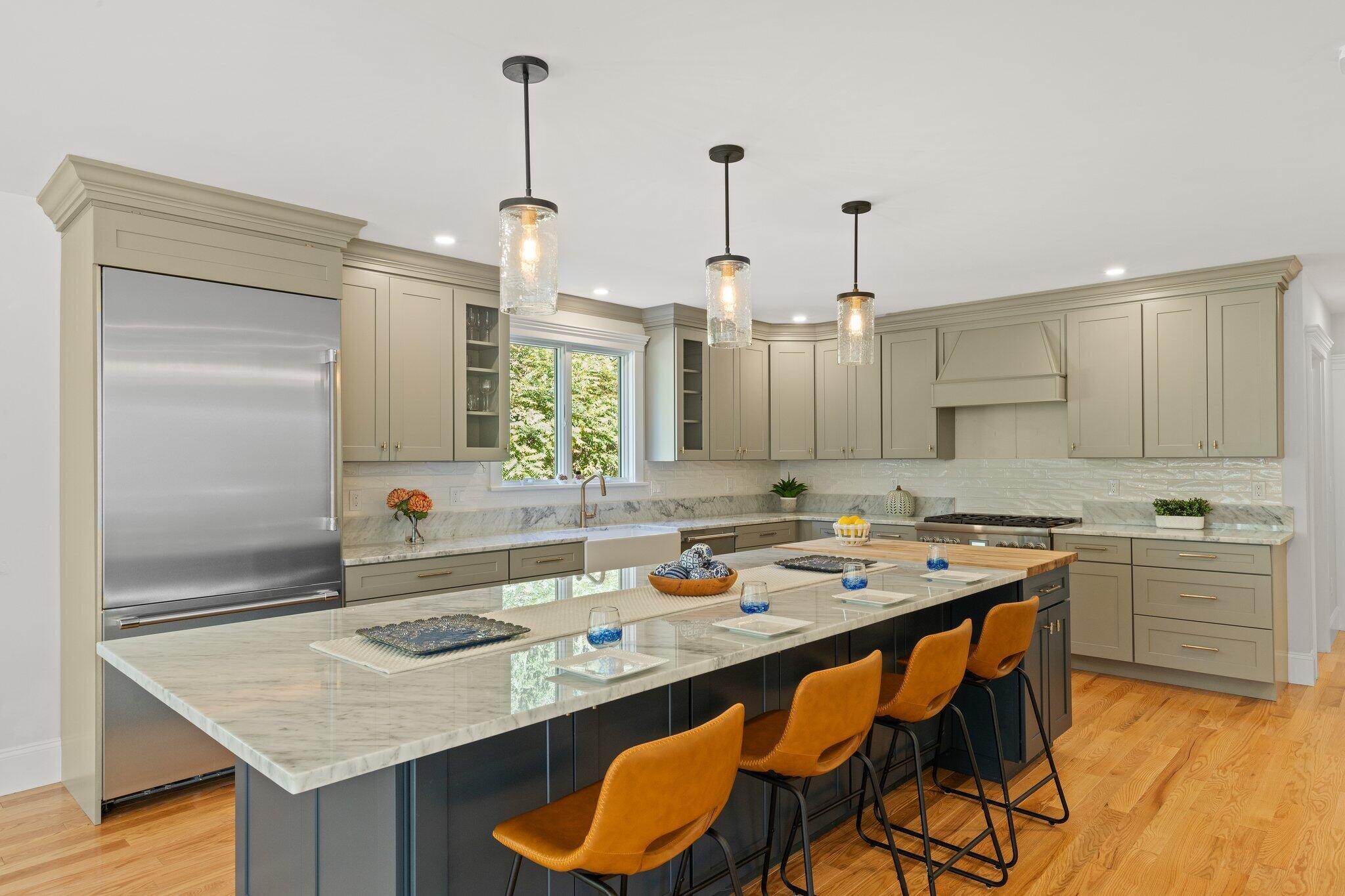 12 Jonathan Lane Sandwich, MA 02563 - Photo 18 of 57 a kitchen with a sink stove and chairs
