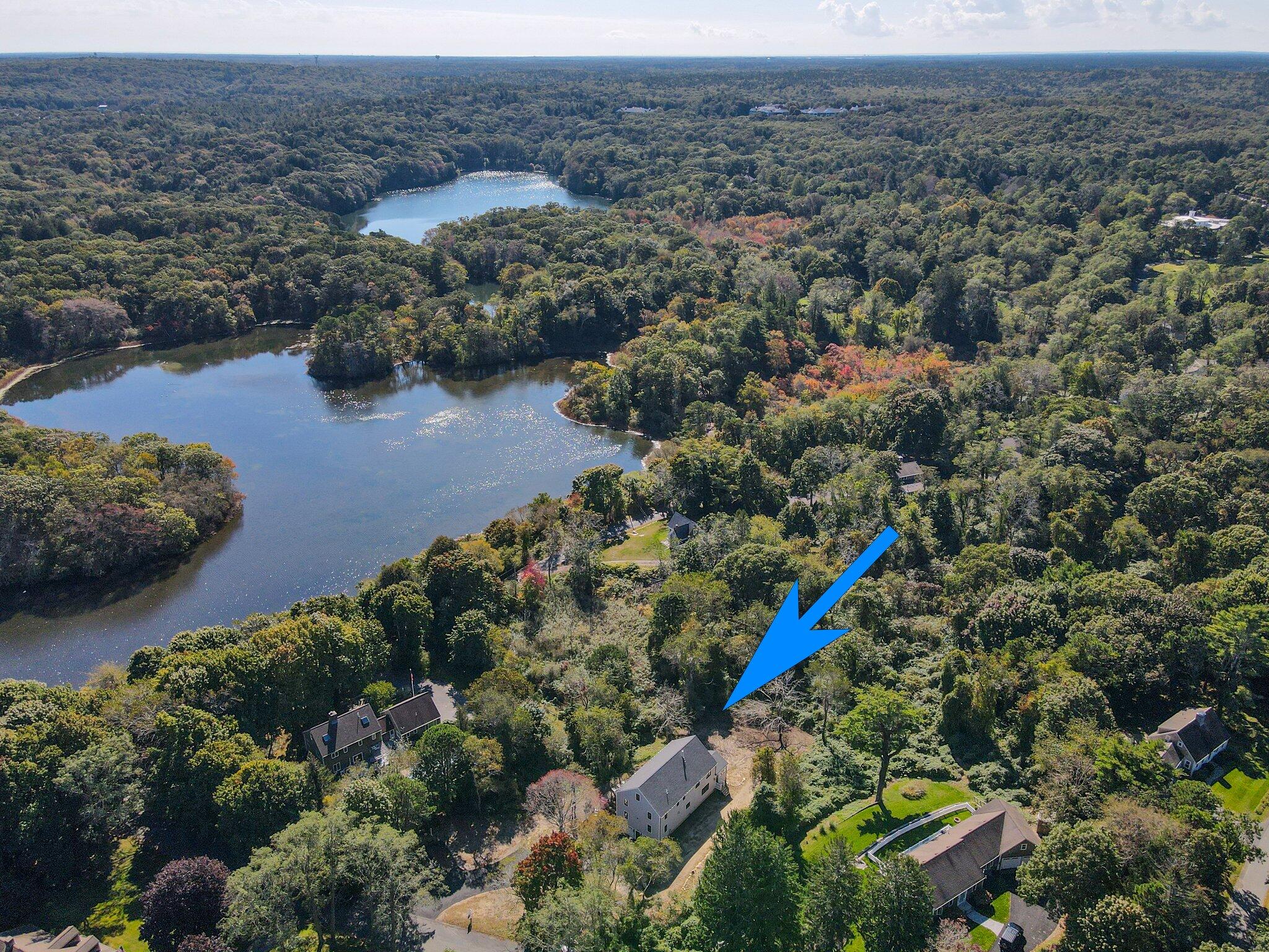 12 Jonathan Lane Sandwich, MA 02563 - Photo 2 of 57 an aerial view of a house with a yard and lake view