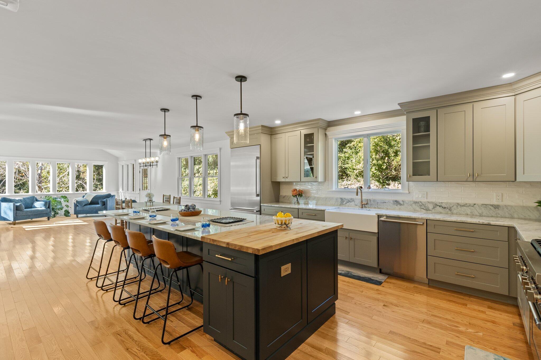 12 Jonathan Lane Sandwich, MA 02563 - Photo 21 of 57 a kitchen with a stove a sink dishwasher and a refrigerator with wooden floor
