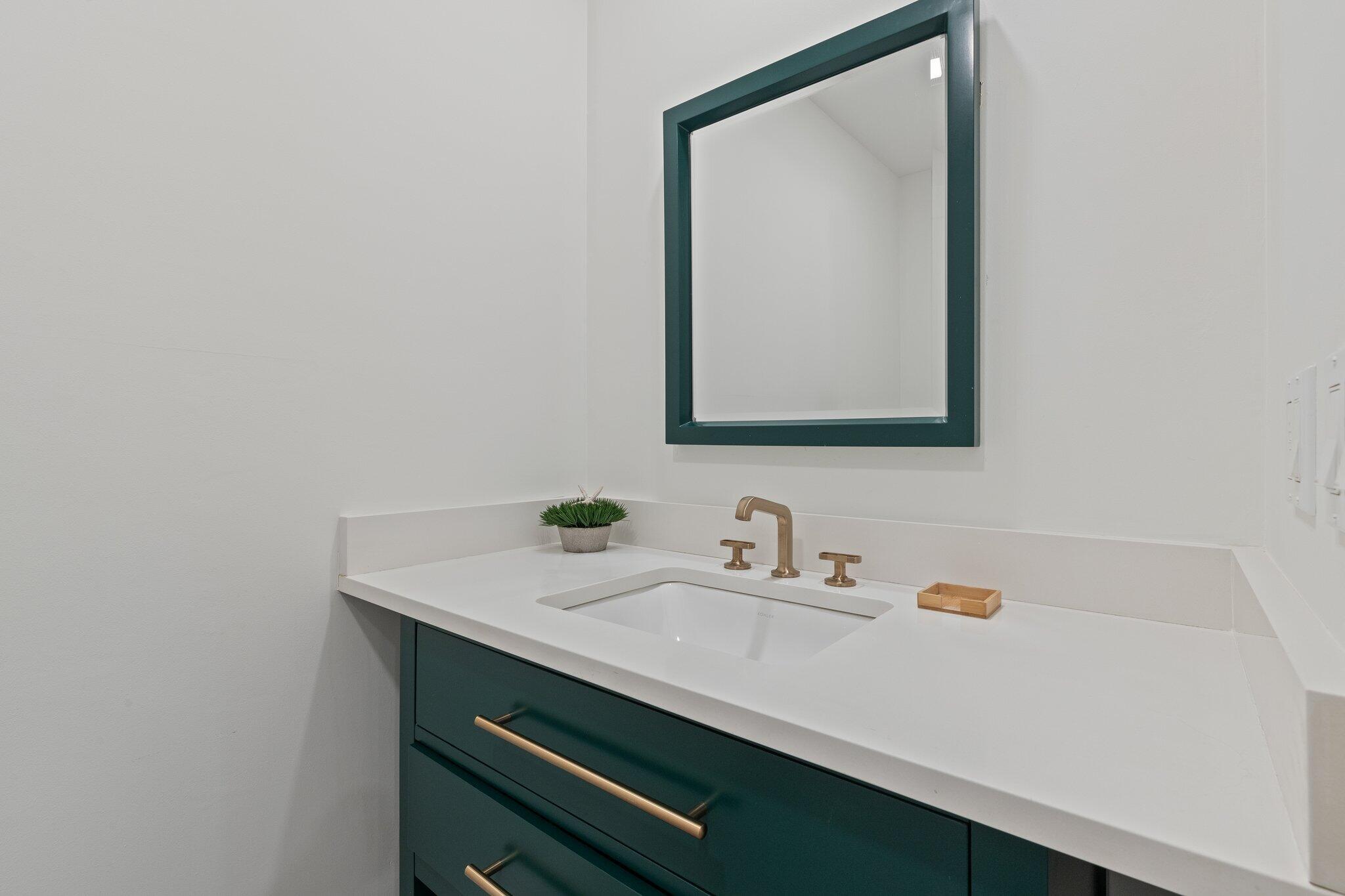 12 Jonathan Lane Sandwich, MA 02563 - Photo 24 of 57 a bathroom with a sink and a mirror
