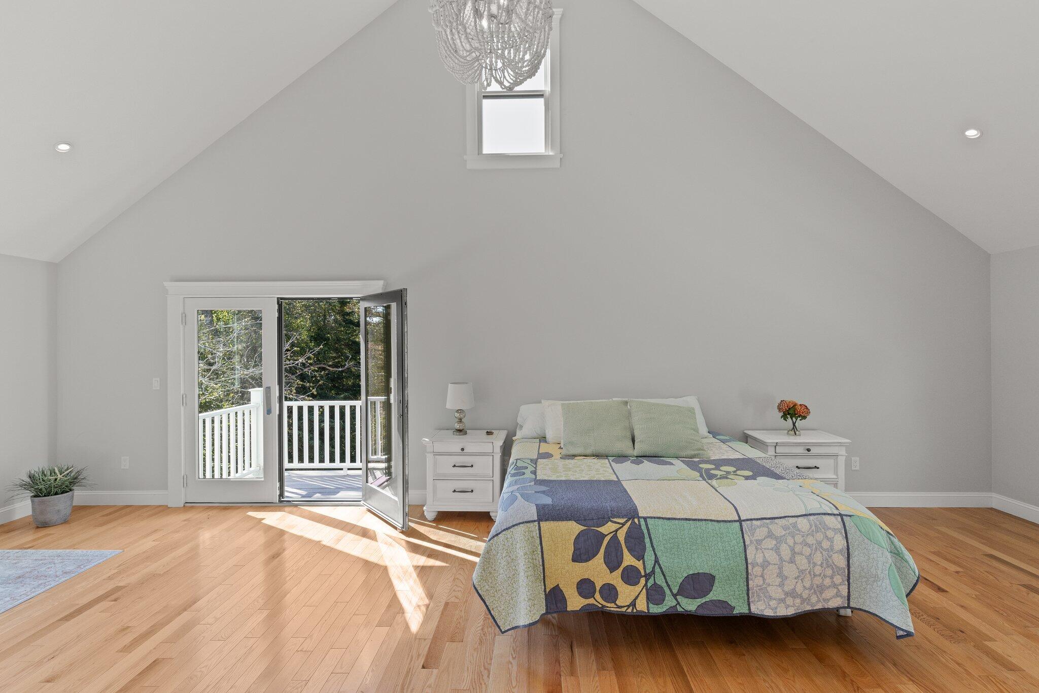 12 Jonathan Lane Sandwich, MA 02563 - Photo 30 of 57 a bedroom with a bed and wooden floor