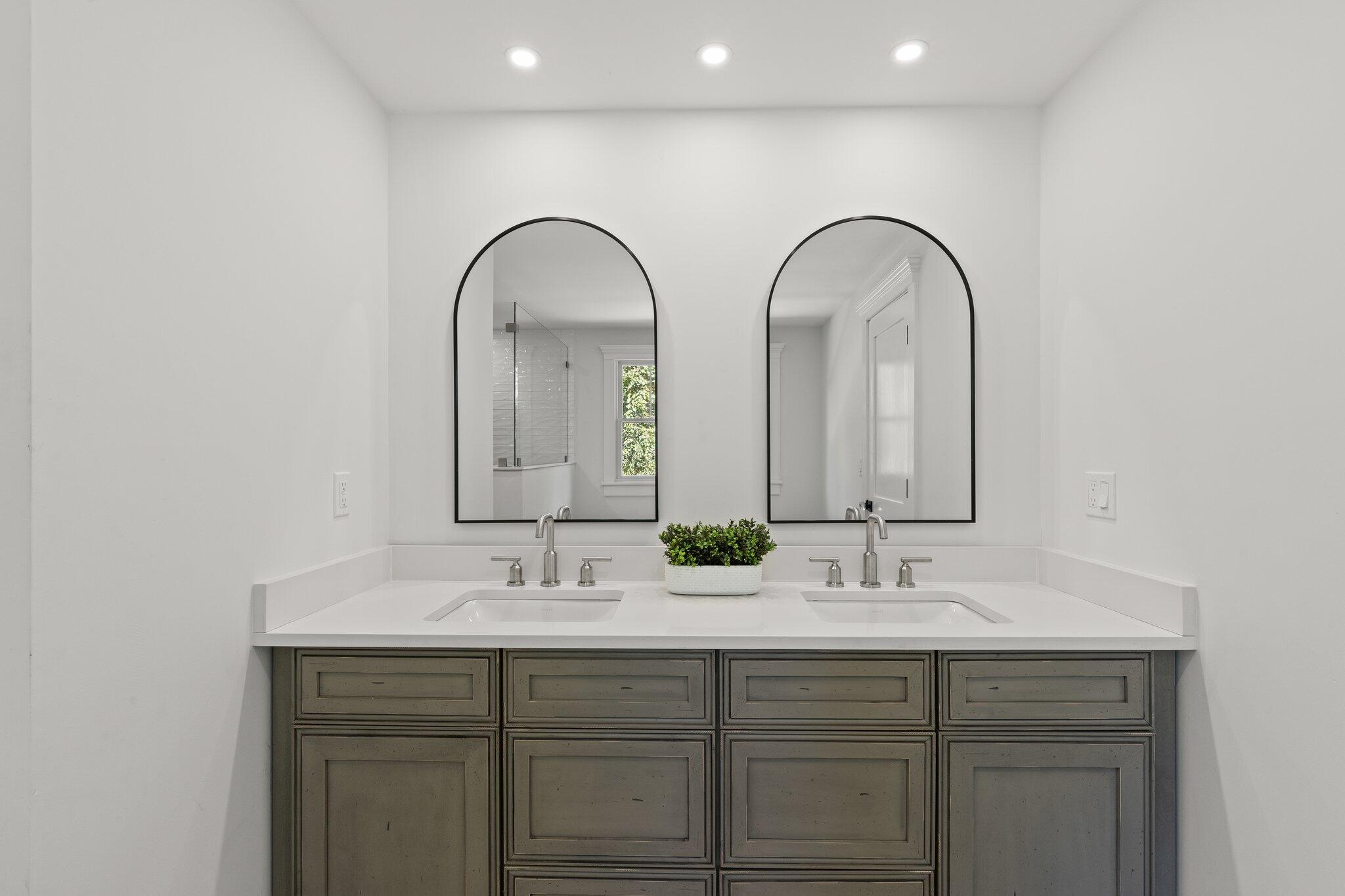 12 Jonathan Lane Sandwich, MA 02563 - Photo 36 of 57 a bathroom with a double vanity sink and a mirror