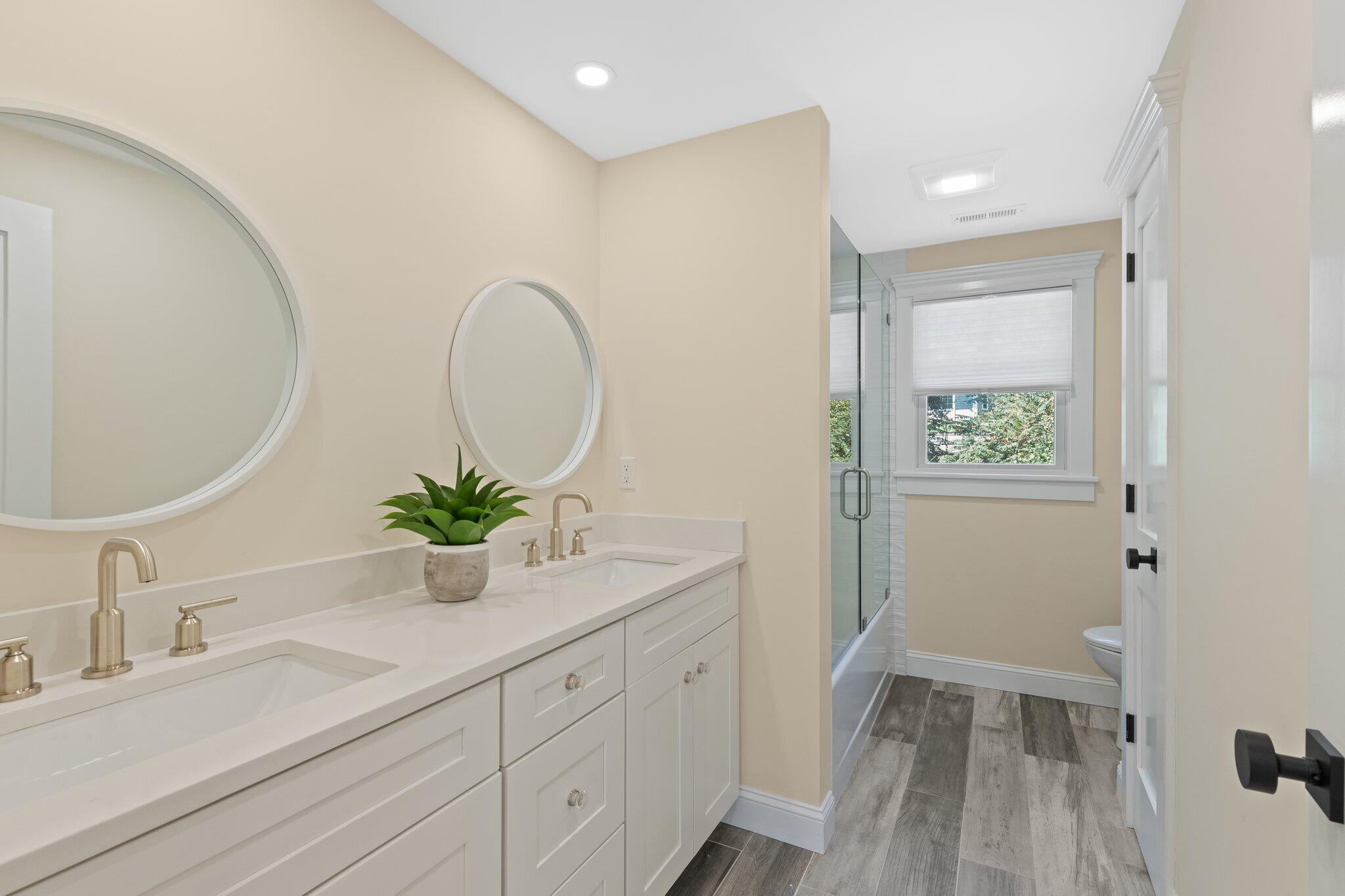 12 Jonathan Lane Sandwich, MA 02563 - Photo 39 of 57 a en suite bathroom with a granite countertop sink and a mirror