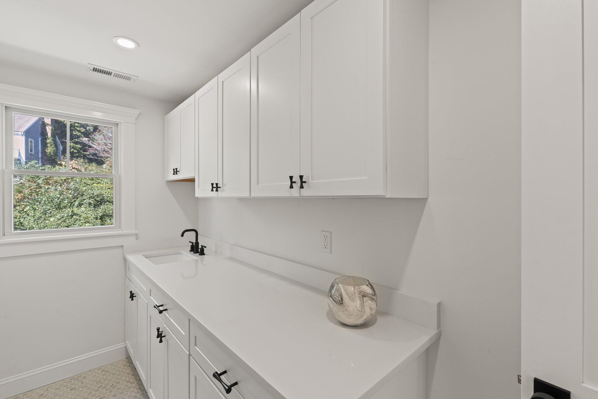 12 Jonathan Lane Sandwich, MA 02563 - Photo 41 of 57 a kitchen with a sink and a window