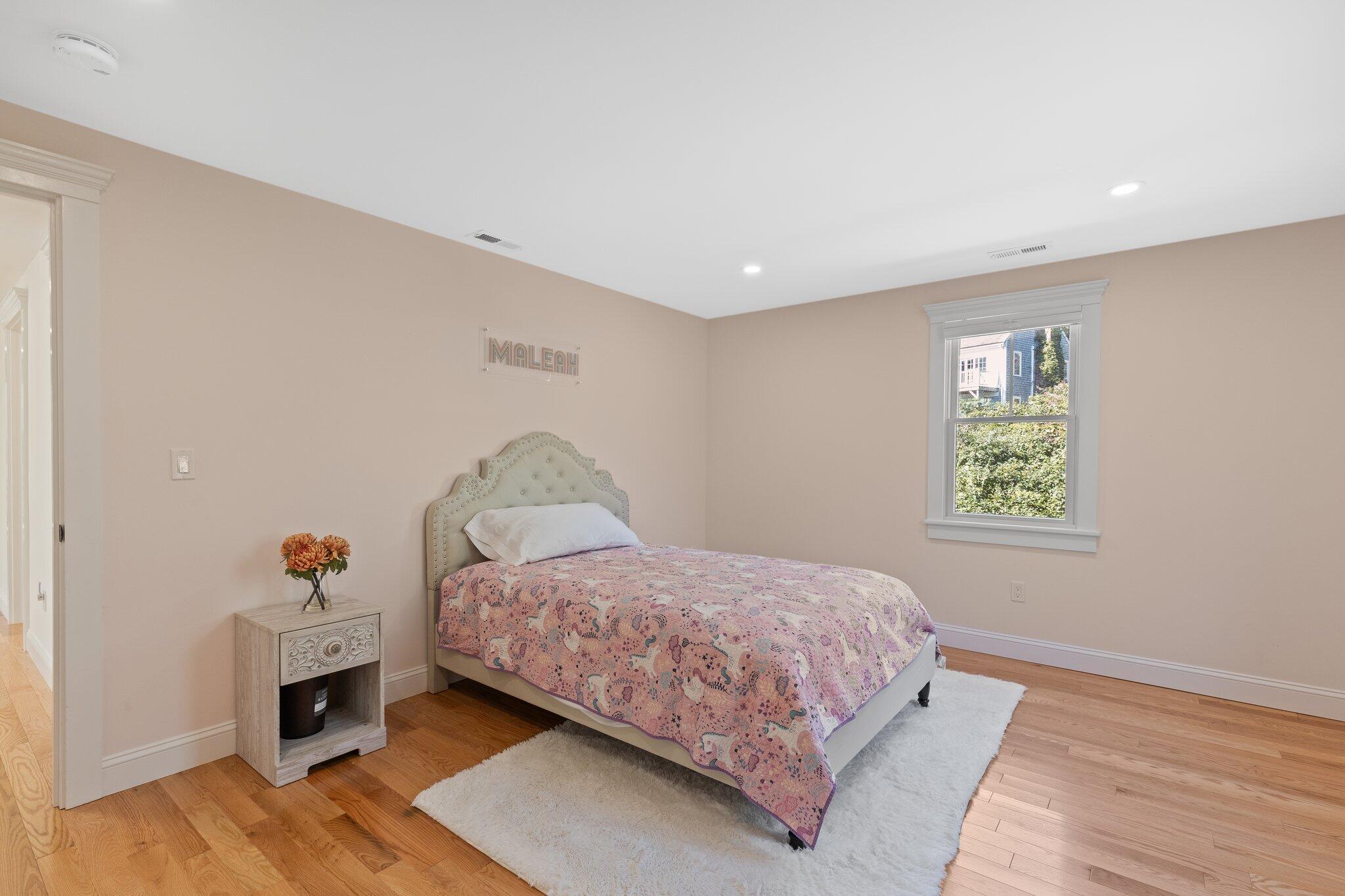 12 Jonathan Lane Sandwich, MA 02563 - Photo 42 of 57 a bedroom with a bed and wooden floor