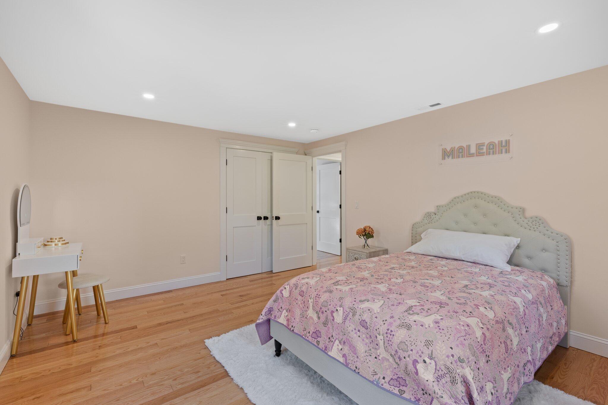 12 Jonathan Lane Sandwich, MA 02563 - Photo 43 of 57 a bedroom with a bed and a table