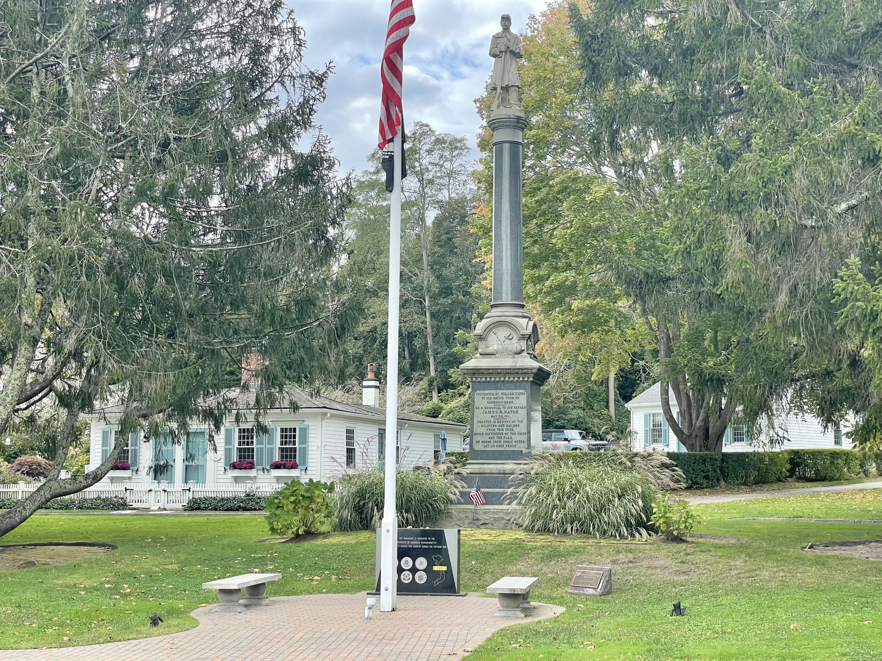 12 Jonathan Lane Sandwich, MA 02563 - Photo 52 of 57 a front view of a house with a yard and trees