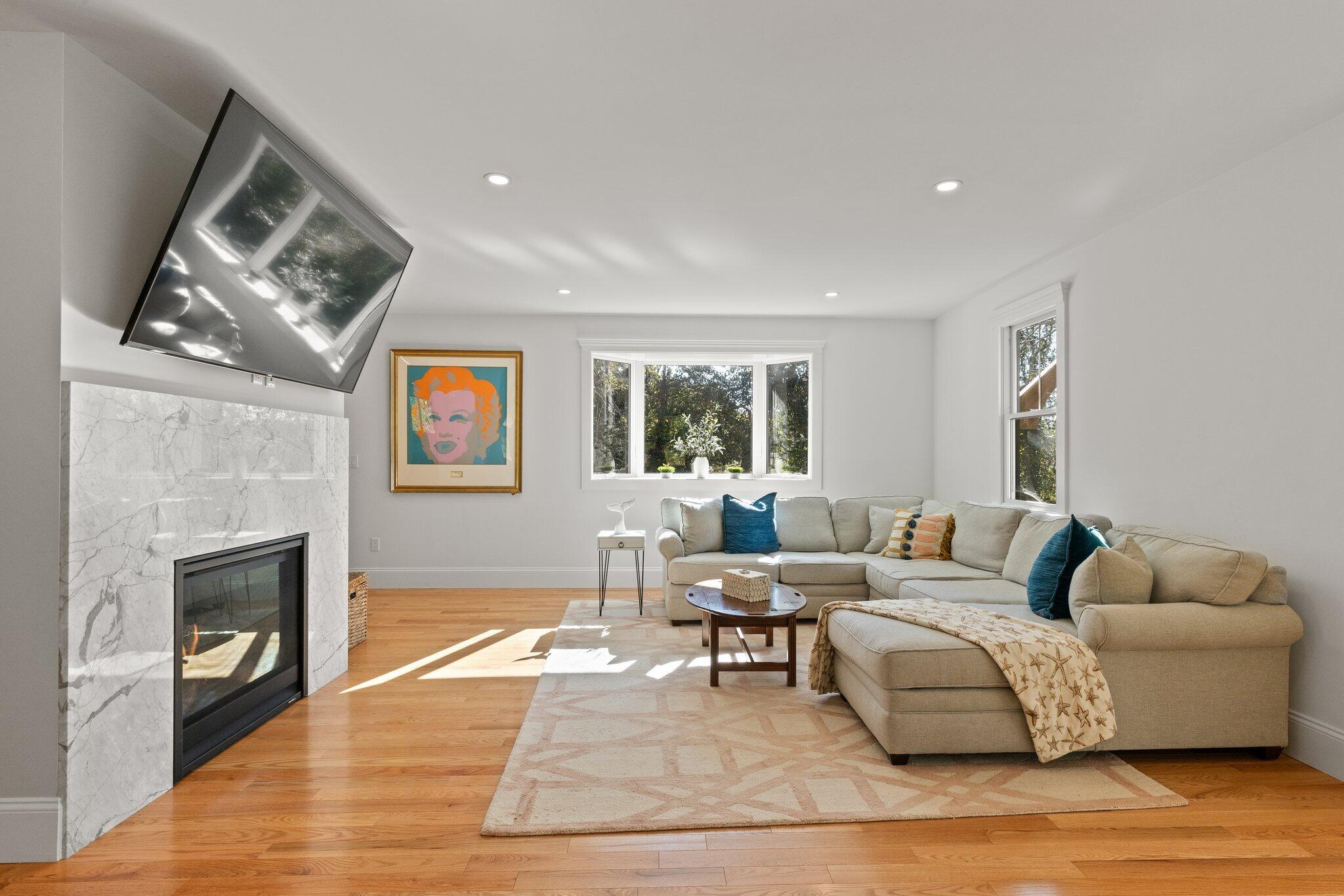 12 Jonathan Lane Sandwich, MA 02563 - Photo 8 of 57 a living room with furniture and a fireplace