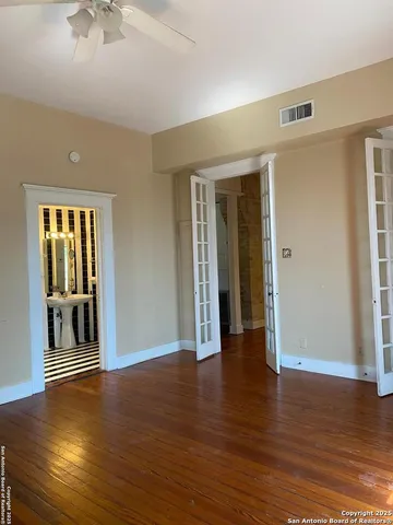 a view of livingroom with hardwood floor and a ceiling fan