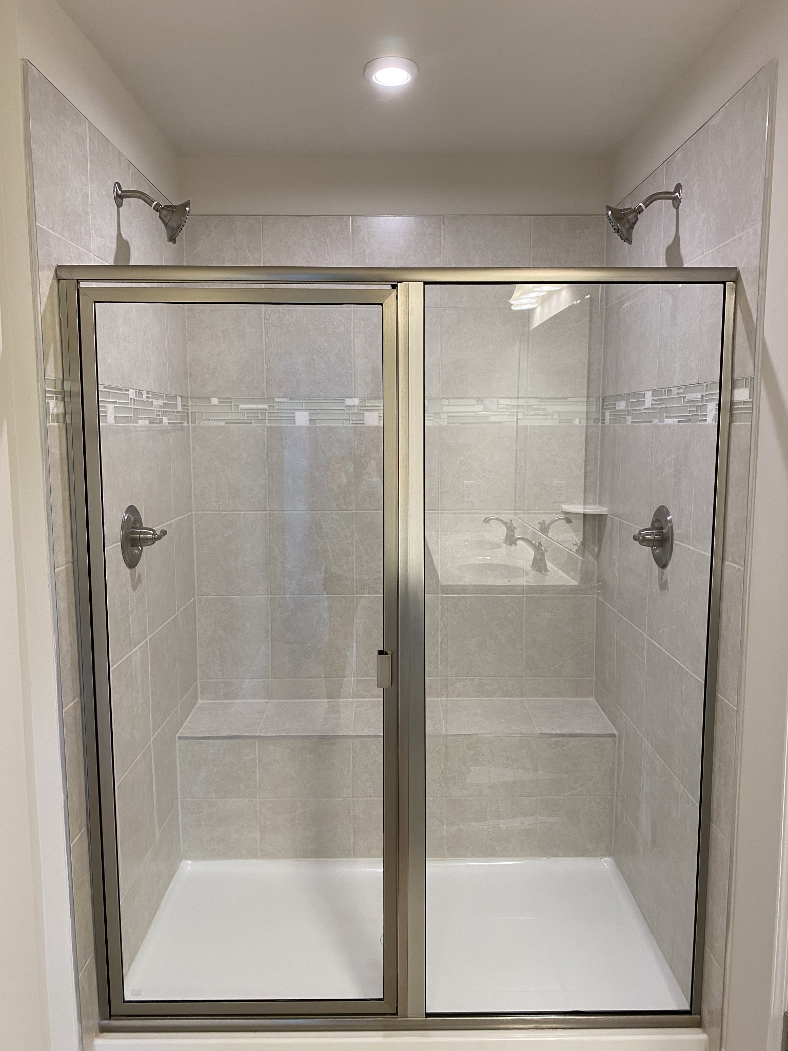 106 Keelon Gap Road, Unit 104A Spring Hill, TN 37174 - Photo 16 of 25 a bathroom with a glass shower door