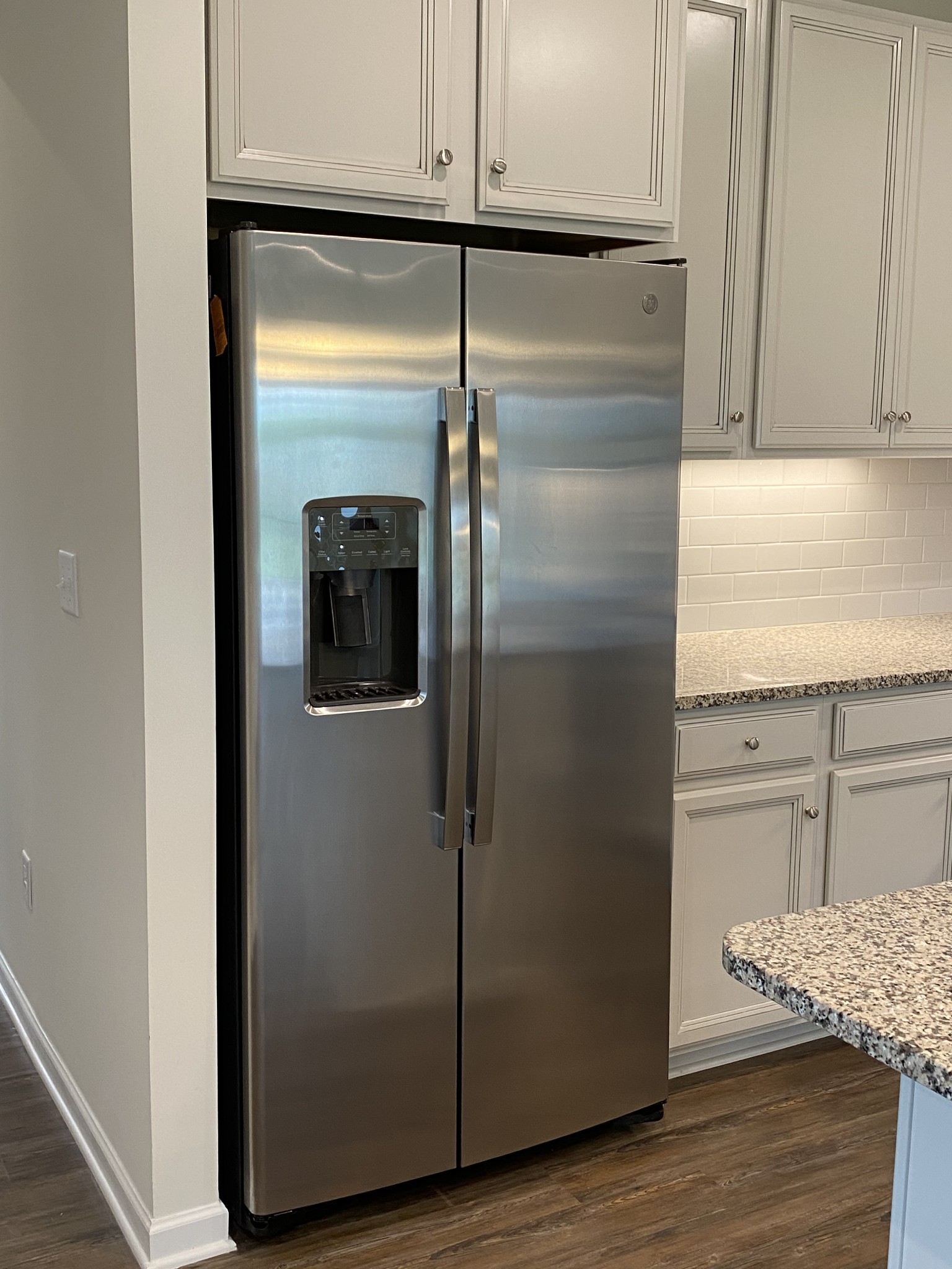 106 Keelon Gap Road, Unit 104A Spring Hill, TN 37174 - Photo 8 of 25 a kitchen with a refrigerator and cabinets