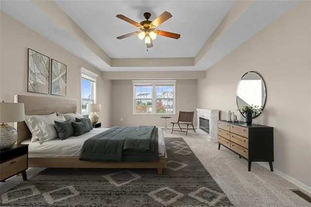 a living room with furniture and a mirror