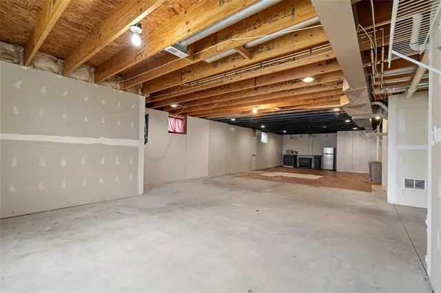 a view of a room with wooden walls