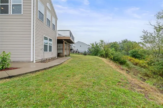 a view of a back yard of the house