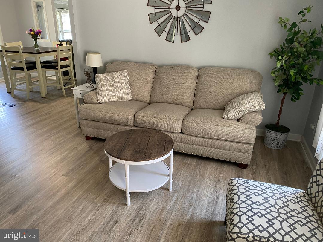 14 Thomas Lane Sparrows Point, MD 21219 - Photo 24 of 26 a living room with furniture and a potted plant