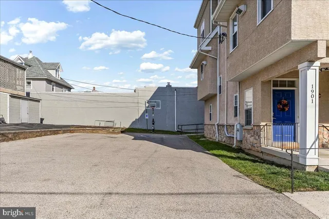 a view of a street with a building in the background