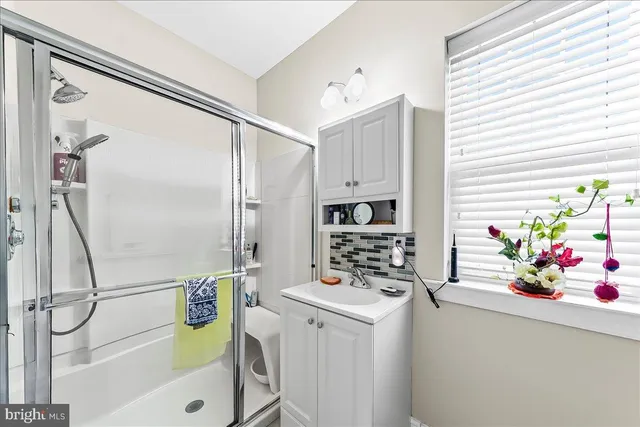 a kitchen with appliances cabinets and furniture
