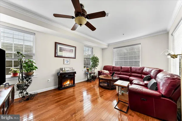 a living room with furniture fireplace and window